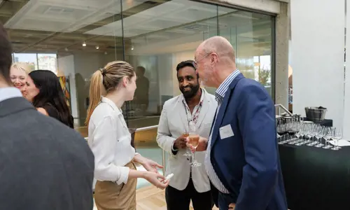 Networking event people listening speaking