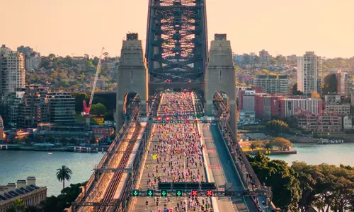 an aerial view of runners on the Sydney Harbouor Bridge