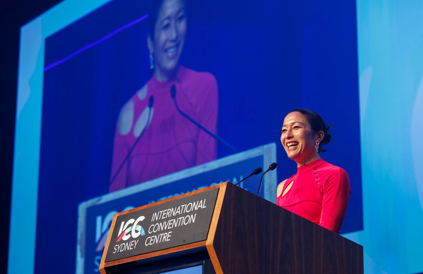 happy speaker on stage