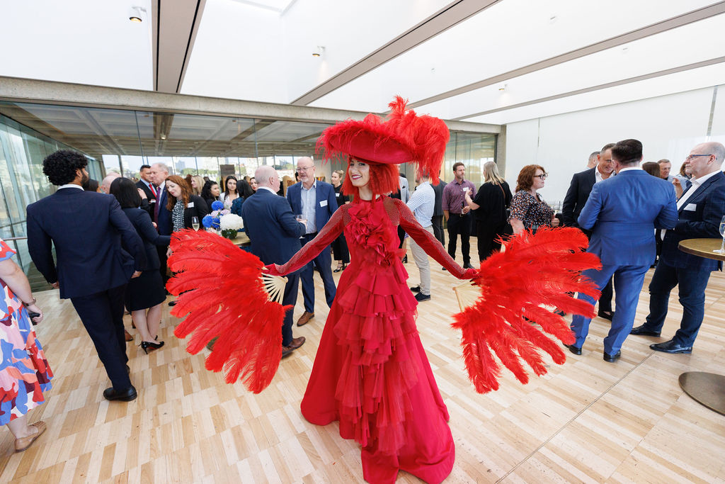 Networking event woman in red costume 
