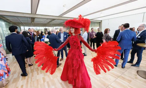 Networking event woman in red costume