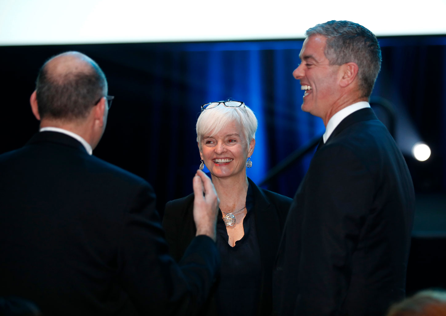 happy people speaking at work conference