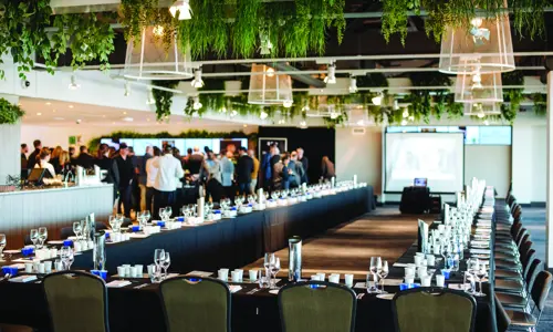 U-shaped event setup with networking area for a corporate function at Rosehill Gardens