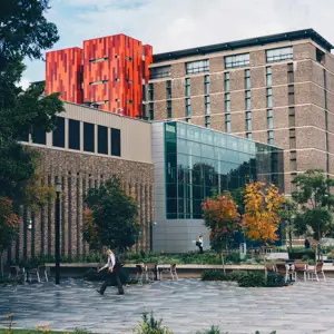 Macquarie University with person walking by, a photo by Fidel Fernando US