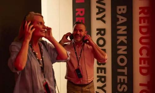 Hyde Park Barracks Sydney - people listening with earphones in a studio. Credit Destination NSW