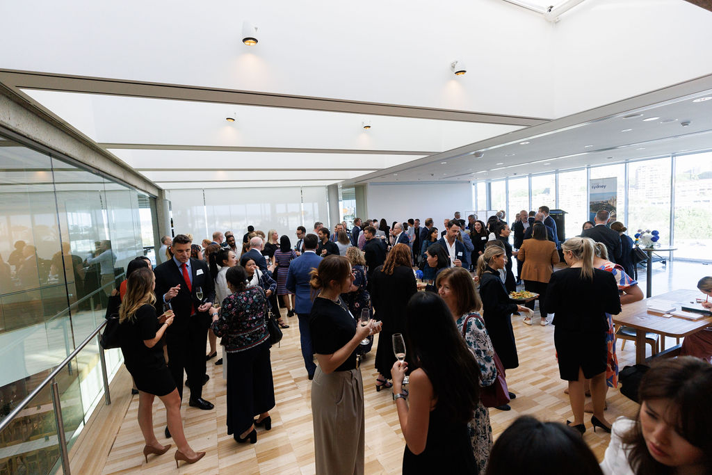 Networking event people speaking in a crowd