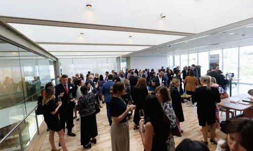 Networking event people speaking in a crowd