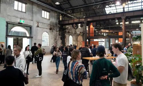 Attendees at an event held at one of the industrial halls at Carriageworks