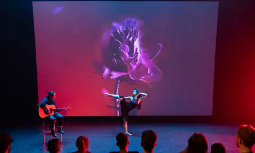 Dancer and guitar artist performing on stage at Casula Powerhouse