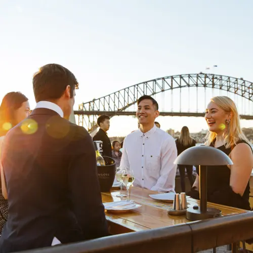 Group of people enjoying a drink and networking at Opera Bar Sydney