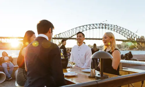 Group of people enjoying a drink and networking at Opera Bar Sydney