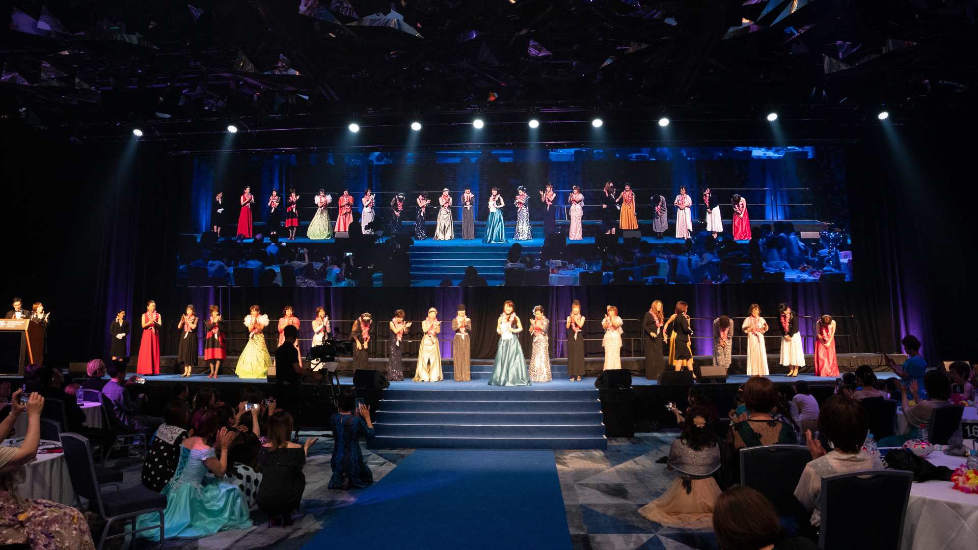 Award receiver delivering speech on stage at the Diana Japan Incentive 2024 