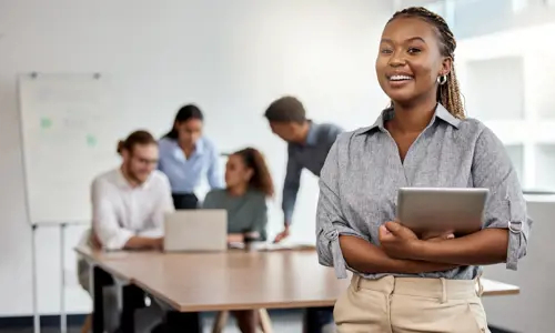 Youthful woman leading a team in technology