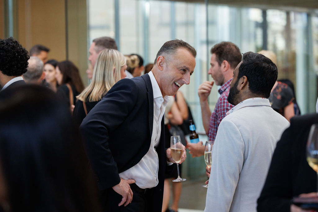 Networking event people listening speaking 