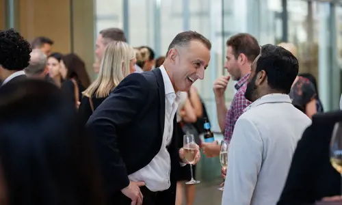 Networking event people listening speaking 