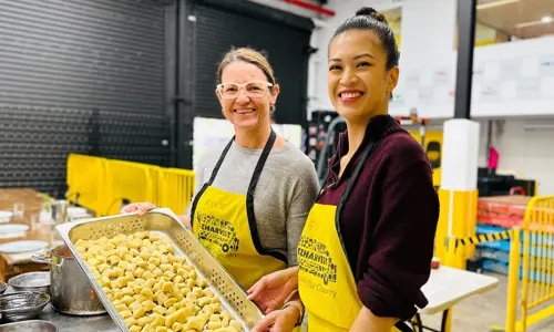 OzHarvest CSR activity two women making food