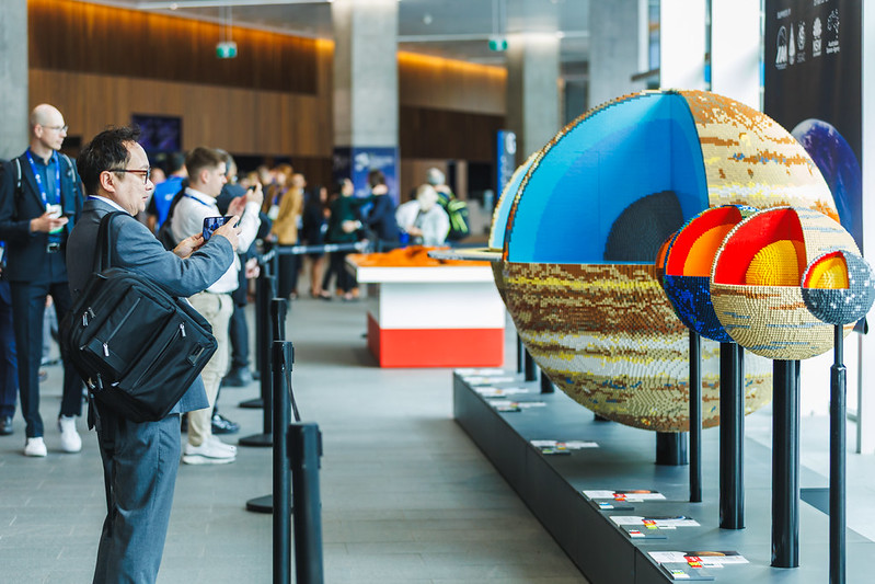 International Astronautical Congress 2025 Attendees Interact With Lego Planet Exhibit