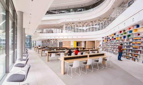 Reading room, Building 2 at Tech Central - students at desks in futuristic looking library