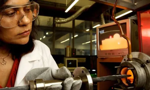 Professor Veena Sahajwalla experimenting with metal