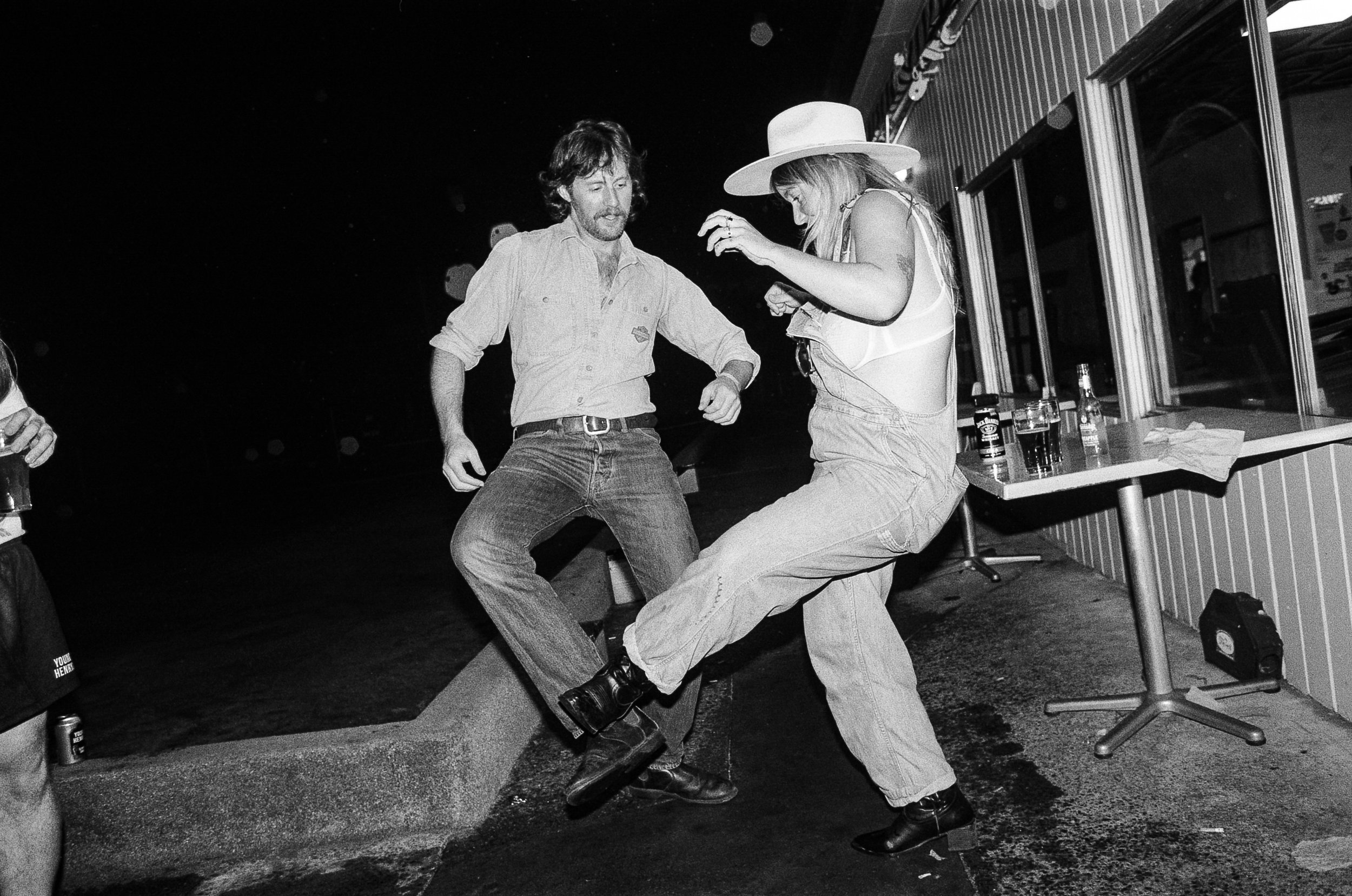 Two guests kicking legs up at Young Henrys