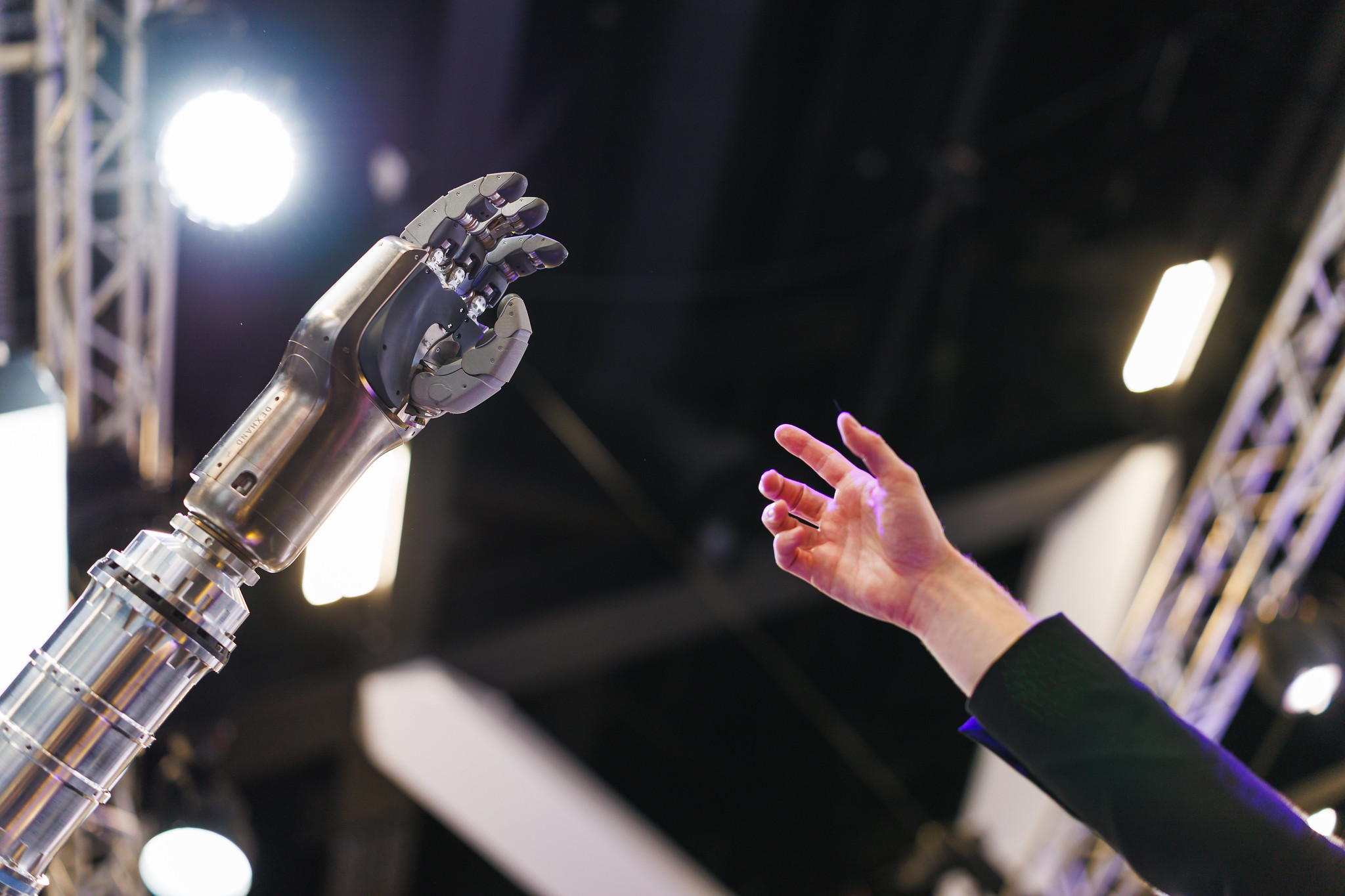 International Astronautical Congress 2025 Robot and Human Hand Reaching Out